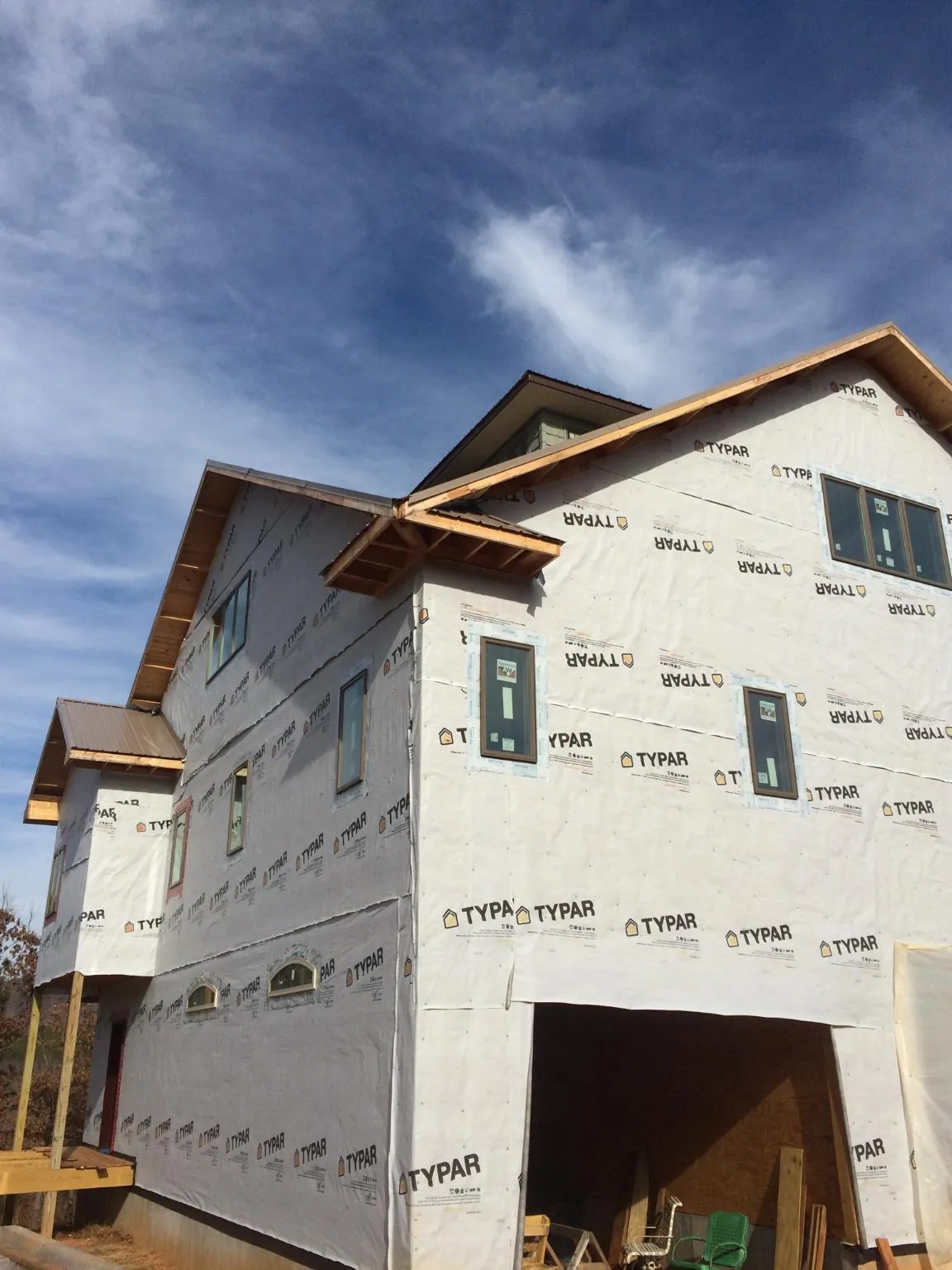 Stick built house wrapped in Typar with new roof framing and dormers in Colfax